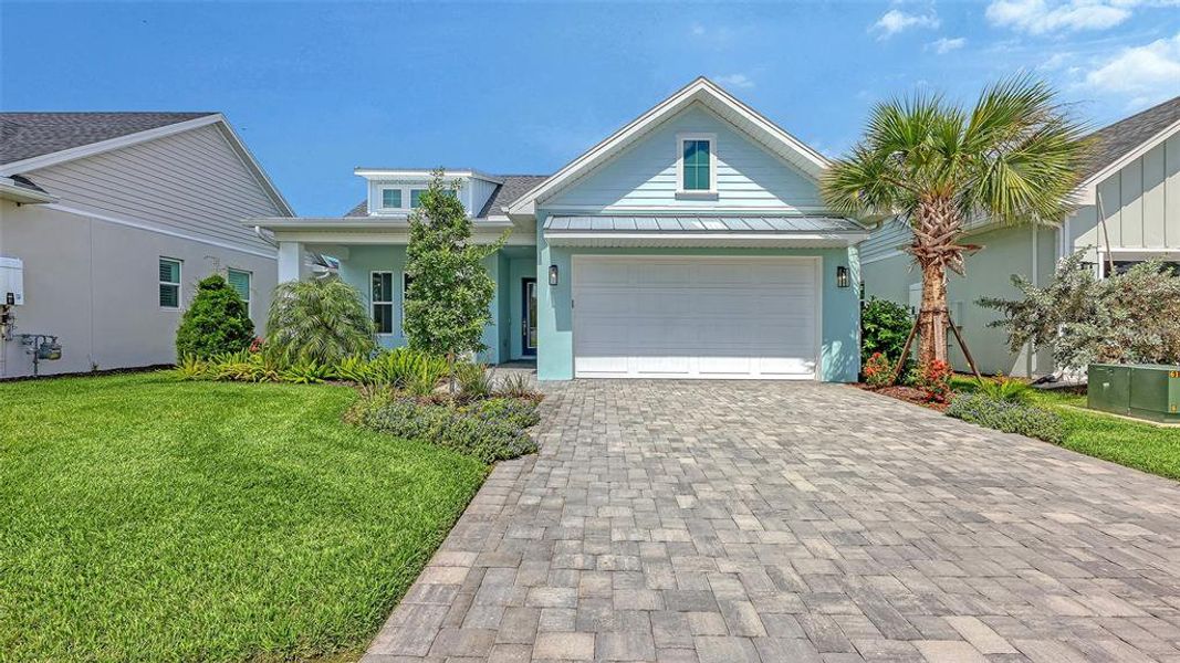 Front exterior of a new home in Gracewater at Sarasota, Sarasota, FL, highlighting curb appeal (Image 28).