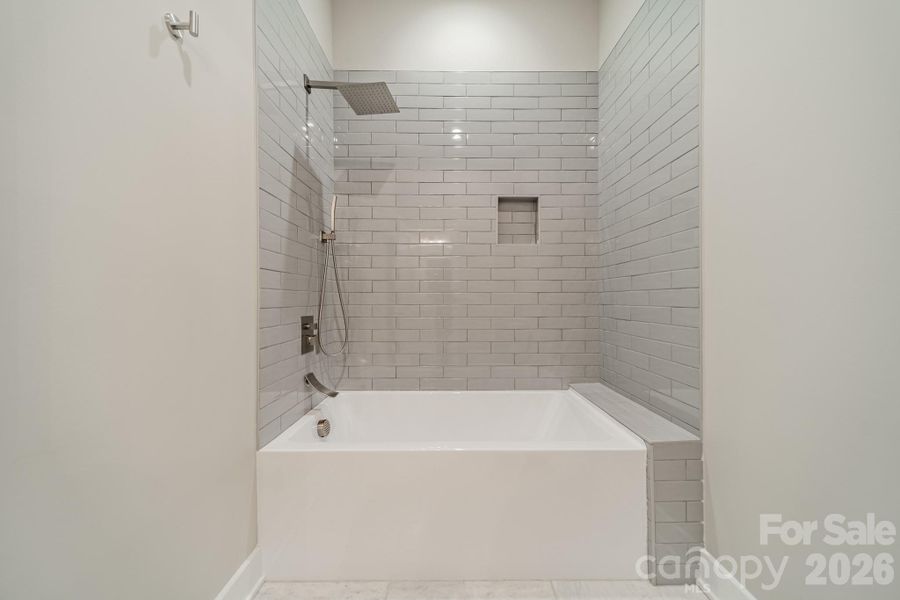 Stunning Full Bathroom for Main Level Bedrooms 1 and 2 with beautiful tilework