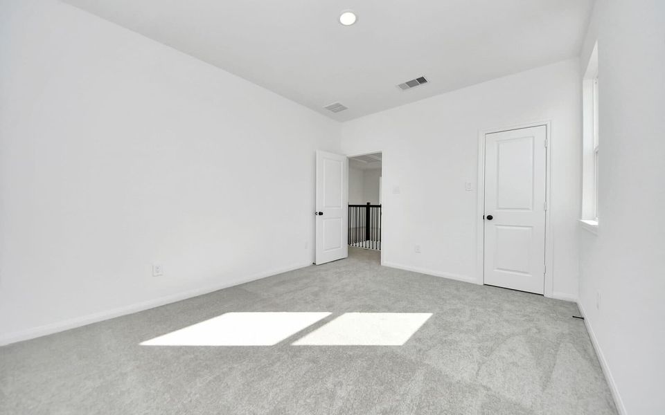 Representative unfurnished interior of a home built from the Montclaire by Brookfield Residential in 50' Traditional Homes at Elyson, Katy (Image 14).