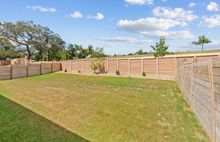 Exterior details and patio area of a home in Bluffview Reserve, Leander (Image 23).