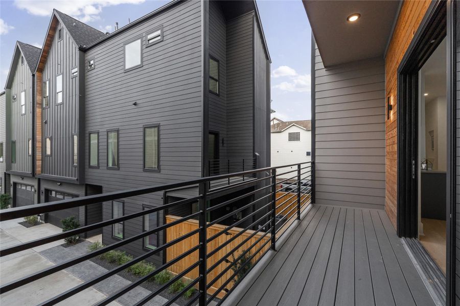 Framed by clean architectural lines and modern wood accents, this private balcony offers a tranquil escape—perfect for a breath of fresh air or a quiet pause between the day’s moments.