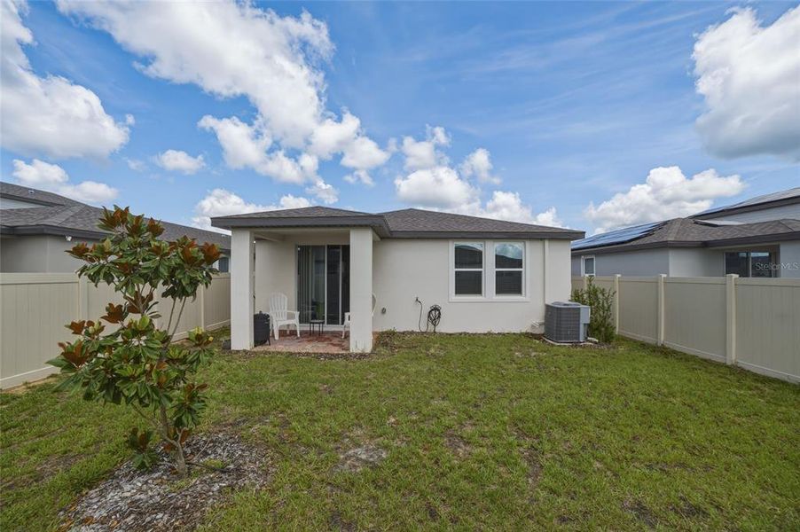 Exterior details and patio area of a home in Springs at Lake Alfred - Classic Series, Lake Alfred (Image 25).