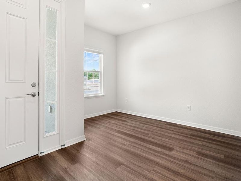 A den, located off the foyer, provides desirable flex-use space - Everly by Highland Homes