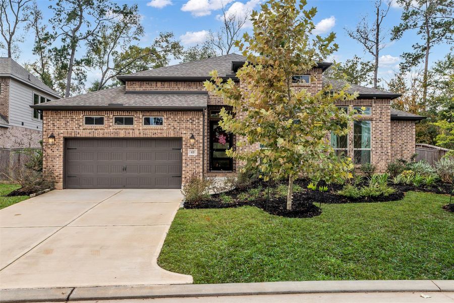 Front exterior of a new home in The Woodlands Hills 75', Conroe, TX, highlighting curb appeal (Image 2). Front exterior of a new home in The Woodlands Hills 75', Conroe, TX, highlighting curb appeal (Image 2).