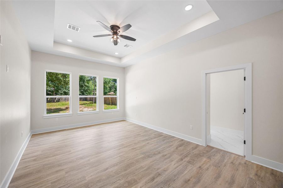 Spacious Primary Retreat is Conveniently Located with Gorgeous En-Suite, His & Hers Closets that Flows Straight into Laundry,