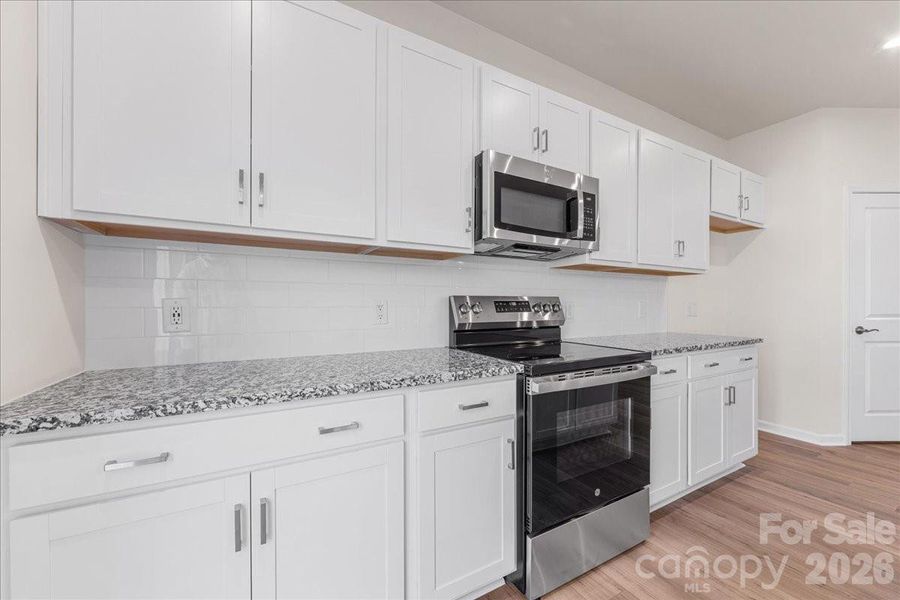 Chef Inspired Kitchen with Oven Range, Microwave and Dishwasher