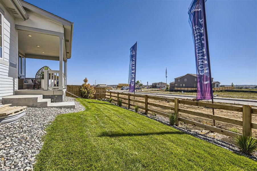 A fenced in yard with a building in the background. A fenced in yard with a building in the background.