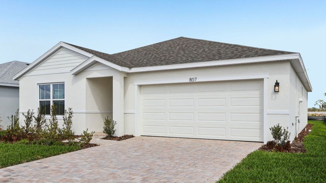 Representative exterior photo of a completed home built from the Baker by DRB Homes in Willowbrook North, Winter Haven, FL (Image 24).