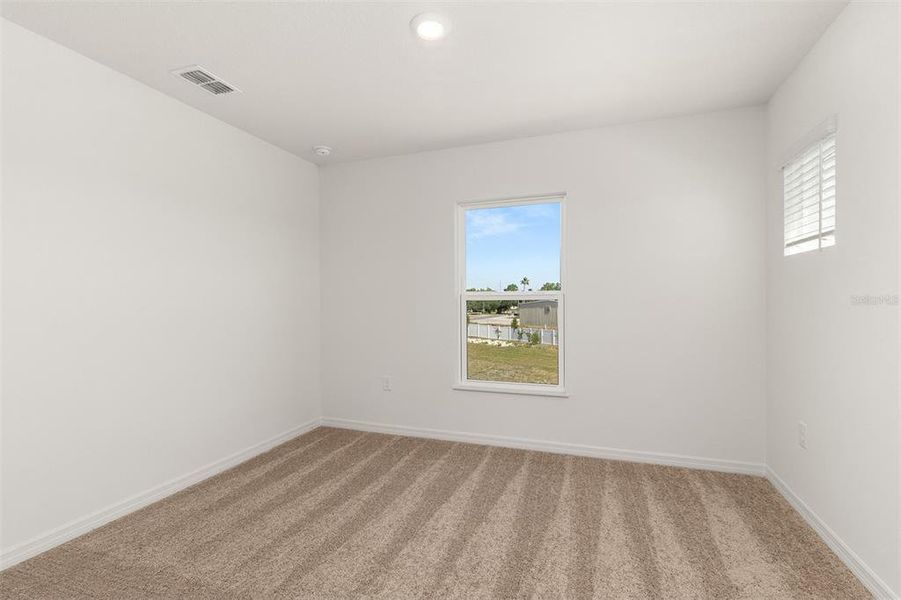 Spacious, unfurnished interior of a new home in Peach Crossings, Winter Haven (Image 22).