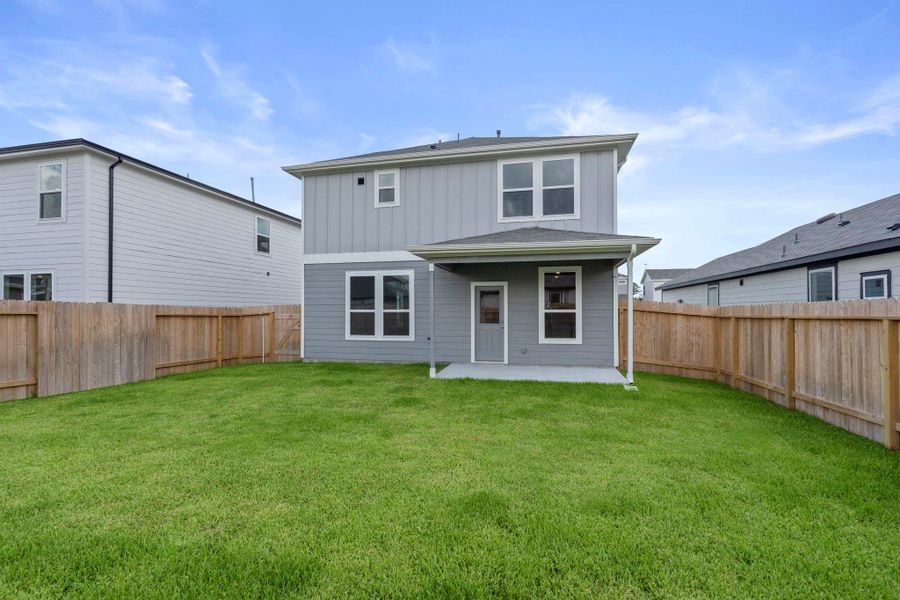 Front exterior of a new home in Peppervine, Porter, TX, highlighting curb appeal (Image 15). Front exterior of a new home in Peppervine, Porter, TX, highlighting curb appeal (Image 15).