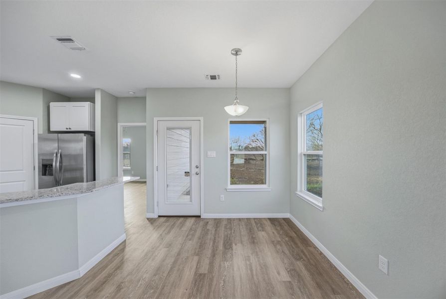Bright dining area with ample natural light, ideal for everyday meals.