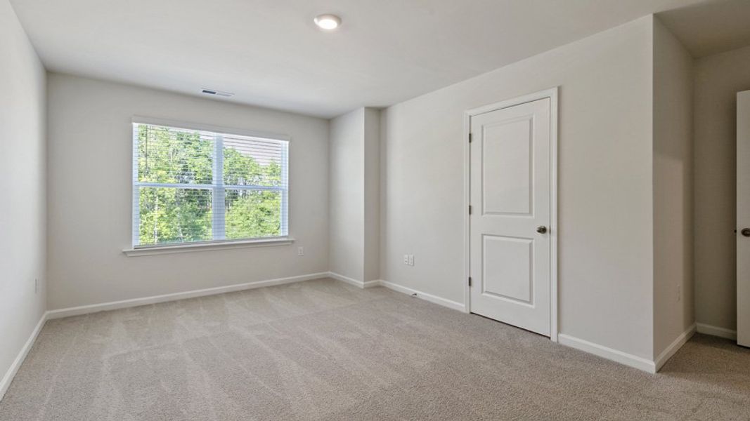 Spacious, unfurnished interior of a new home in Edinborough Townes, Gibsonville (Image 12).