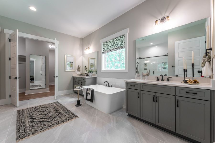 30. HHHunt Homes Crawford- First Floor Primary Bathroom With Soaking tub