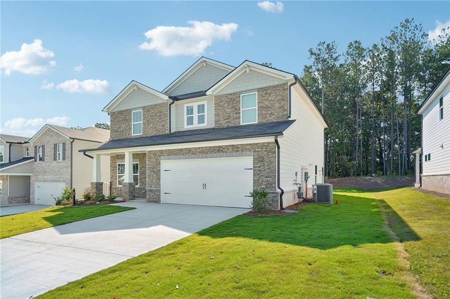 Front exterior of a new home in Parkside at Grayson, Grayson, GA, highlighting curb appeal (Image 2).