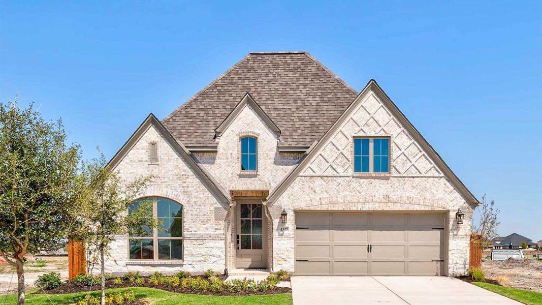Front exterior of a new home in Mosaic 50', Celina, TX, highlighting curb appeal (Image 2). Front exterior of a new home in Mosaic 50', Celina, TX, highlighting curb appeal (Image 2).