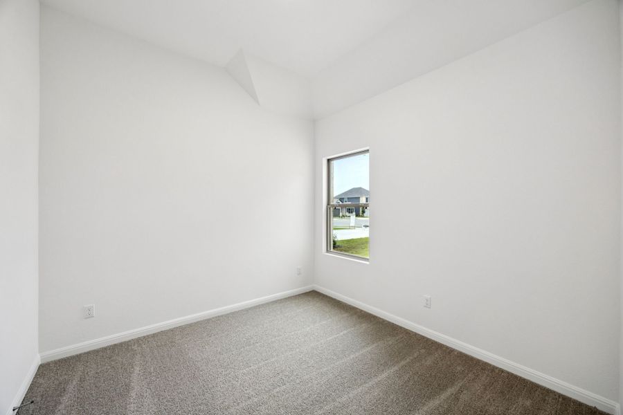 Bedroom in the Spruce home plan by Trophy Signature Homes - REPRESENTATIVE PHOTO