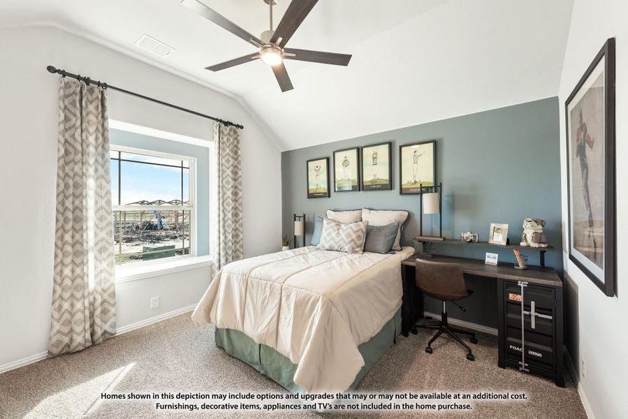 Bedroom with vaulted ceiling, blue accent wall, ceiling fan, and a desk area next to a window Bedroom with vaulted ceiling, blue accent wall, ceiling fan, and a desk area next to a window