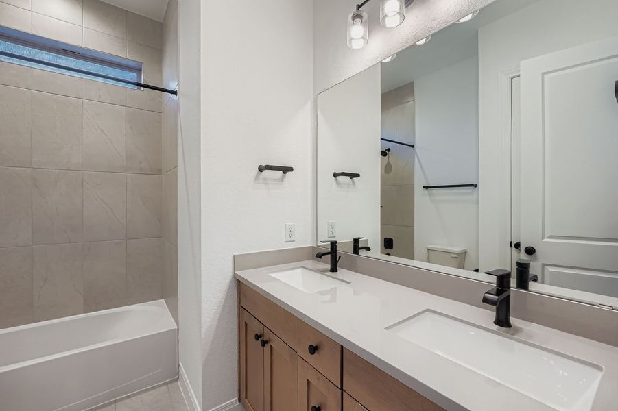 Furnished interior view inside a new home in 6 Creeks, Kyle (Image 4).