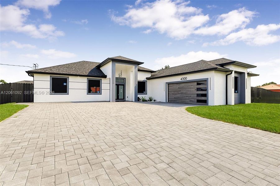 Front exterior of a new home in , Lehigh Acres, FL, highlighting curb appeal (Image 33). Front exterior of a new home in , Lehigh Acres, FL, highlighting curb appeal (Image 33).