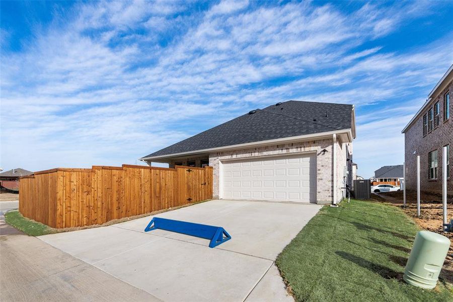Exterior details and patio area of a home in Villages of Creekwood, Frisco (Image 24).