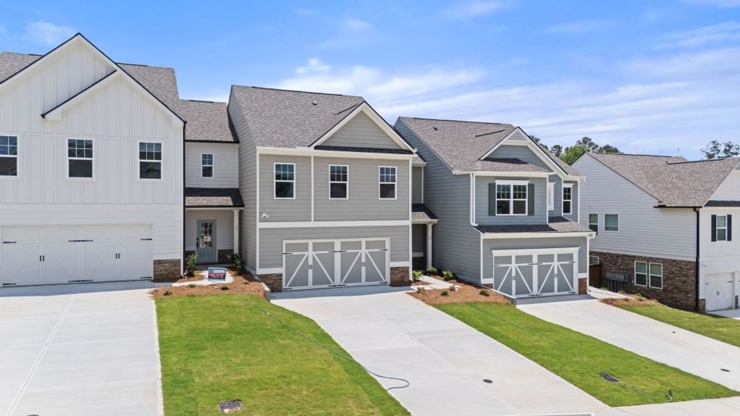 Front exterior of a new home in The Retreat at Browns Ridge, Newnan, GA, highlighting curb appeal (Image 4). Front exterior of a new home in The Retreat at Browns Ridge, Newnan, GA, highlighting curb appeal (Image 4).