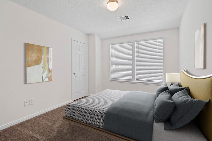 Secondary bedroom features plush carpet, neutral paint, lighting, large windows with privacy blinds and ample sized closet space.