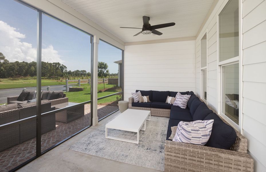 Feel the soft breeze as your relax in the screened patio.