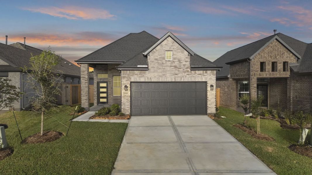 Front exterior of a new home in Emory Glen, Magnolia, TX, highlighting curb appeal (Image 1). Front exterior of a new home in Emory Glen, Magnolia, TX, highlighting curb appeal (Image 1).