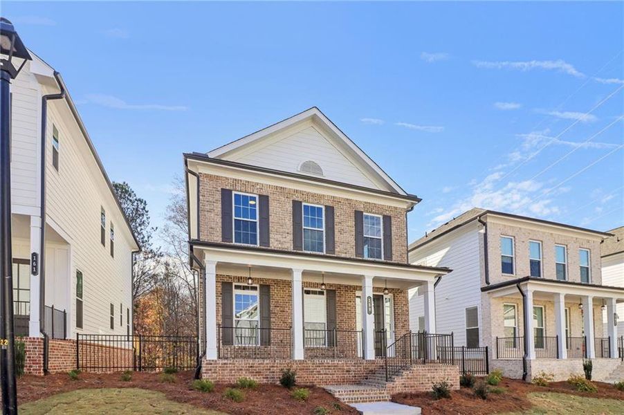 Front exterior of a new home in Brackley Single Family, Cumming, GA, highlighting curb appeal (Image 31). Front exterior of a new home in Brackley Single Family, Cumming, GA, highlighting curb appeal (Image 31).