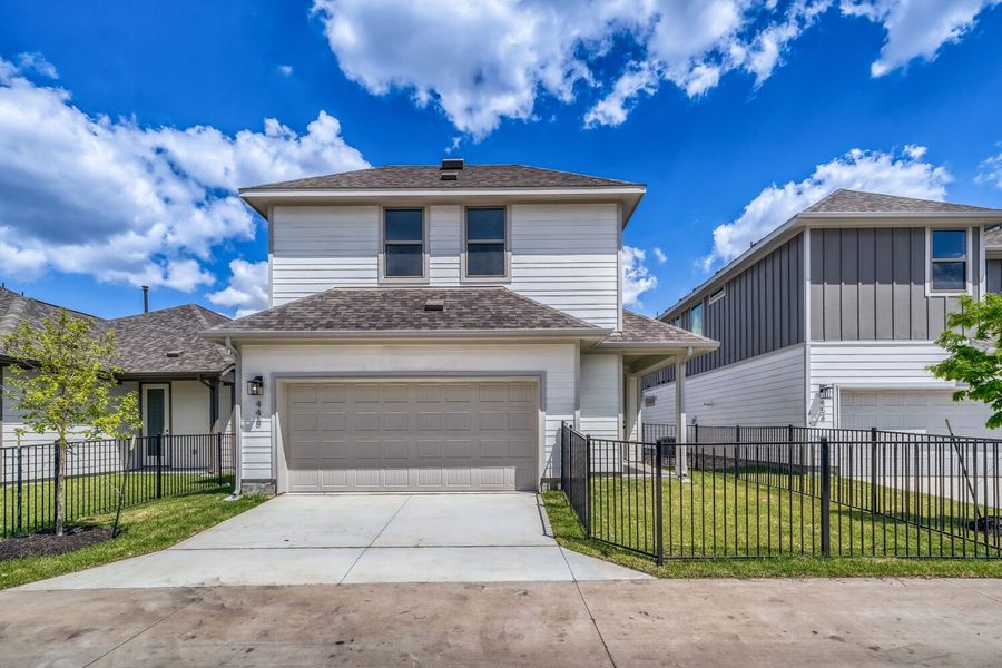 Front exterior of a new home in The Porch at Du Pre, Buda, TX, highlighting curb appeal (Image 2). Front exterior of a new home in The Porch at Du Pre, Buda, TX, highlighting curb appeal (Image 2).