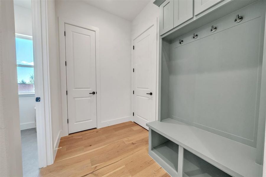 Mudroom featuring light wood-type flooring