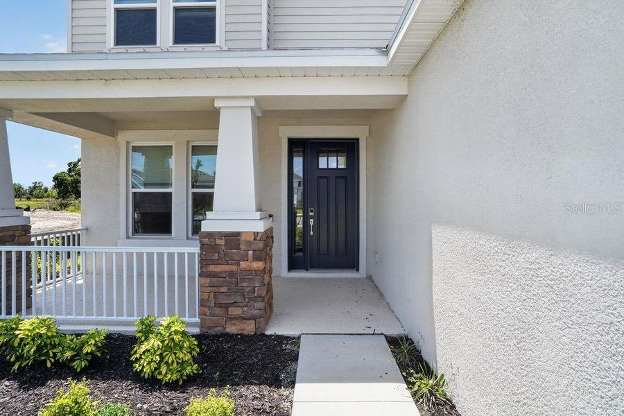 Exterior details and patio area of a home in Firethorn, Parrish (Image 23).