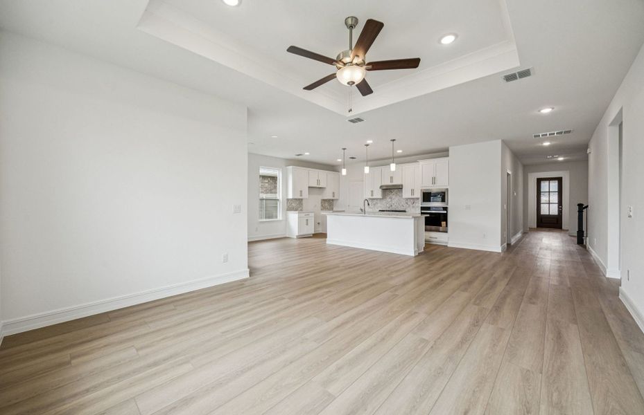 Open concept gathering room creating a spacious and inviting atmosphere  *Real home pictured