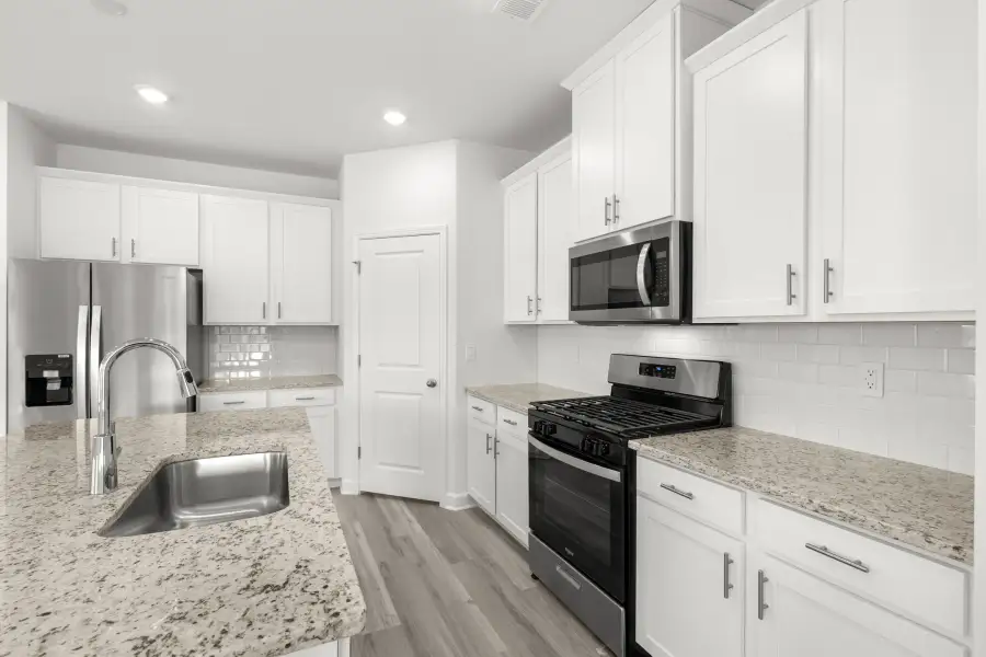 Furnished interior view inside a new home in Waterside - Boardwalk Series, Longs (Image 3).