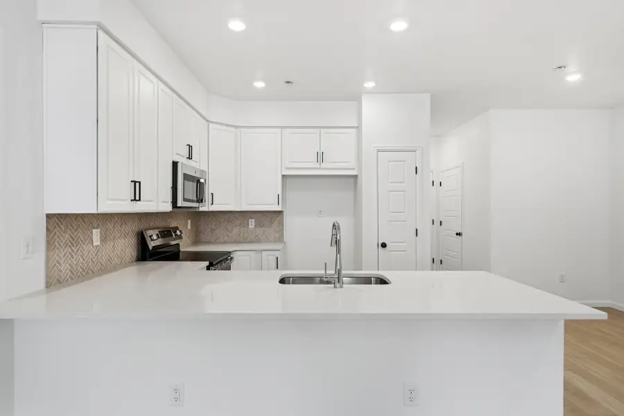 Furnished interior view inside a new home in Trailstone, Arvada (Image 3).