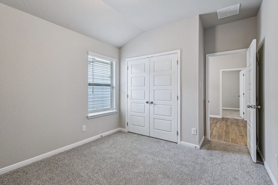 Guest bedroom in the Allen floorplan at a Meritage Homes community. Guest bedroom in the Allen floorplan at a Meritage Homes community.