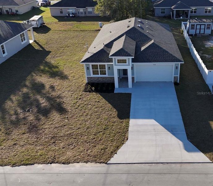 Front exterior of a new home in , Summerfield, FL, highlighting curb appeal (Image 2).