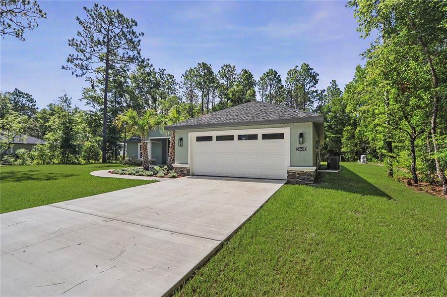 Front exterior of a new home in , Dunnellon, FL, highlighting curb appeal (Image 30).