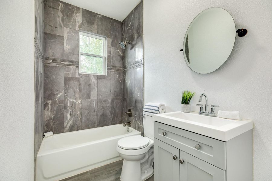 Modern full bathroom with updated finishes.