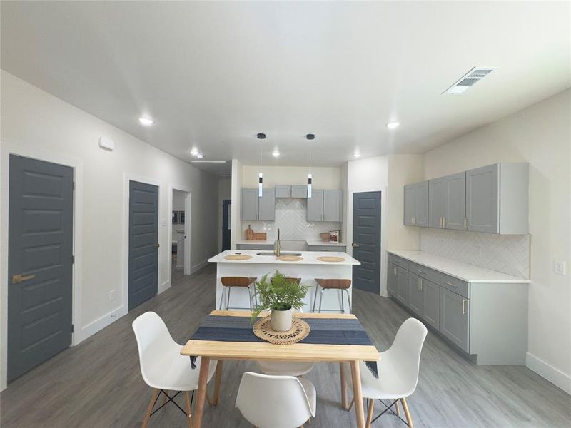 Dining room featuring sink and dark hardwood / wood-style floors