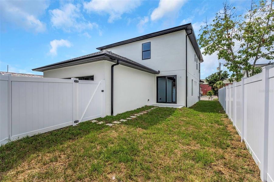 Front exterior of a new home in , Tampa, FL, highlighting curb appeal (Image 13).