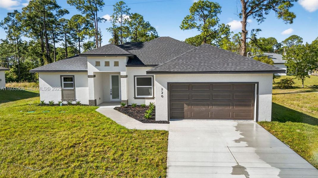 Front exterior of a new home in , Lehigh Acres, FL, highlighting curb appeal (Image 22).