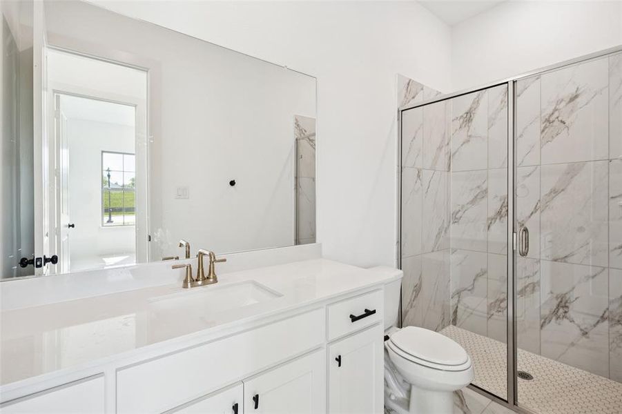 Friends and family will feel right at home in either of the beautifully finished guest baths in our Bella plan.