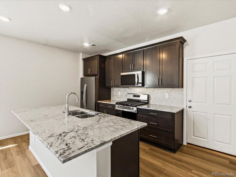 Furnished interior view inside a new home in Skyview at High Point, Aurora (Image 3).