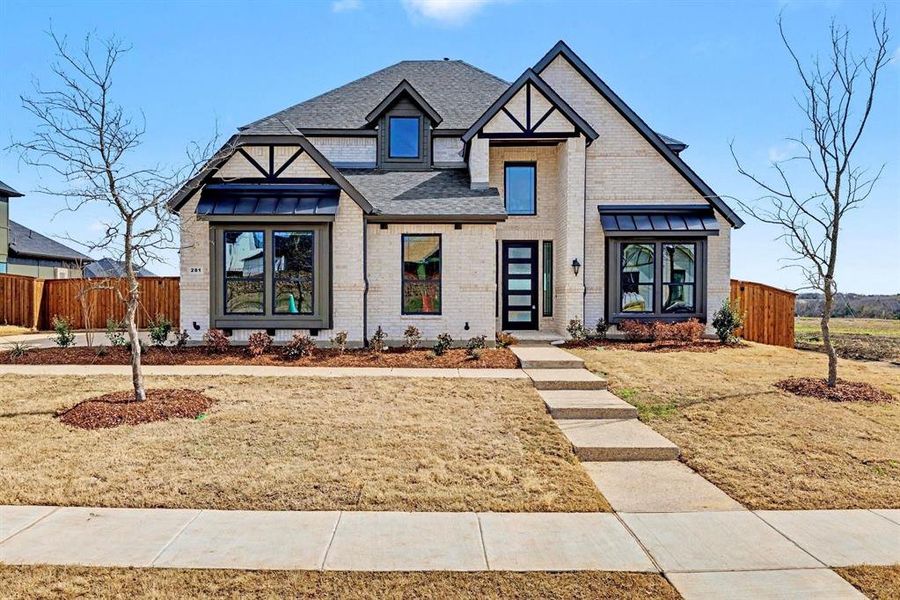 Front exterior of a new home in Malabar Hill, Prosper, TX, highlighting curb appeal (Image 1). Front exterior of a new home in Malabar Hill, Prosper, TX, highlighting curb appeal (Image 1).