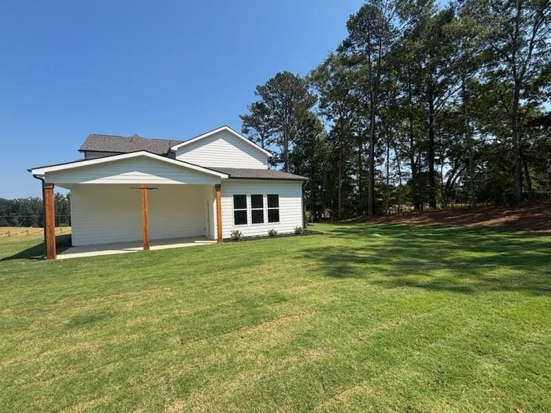 Front exterior of a new home in Pinegate, Covington, GA, highlighting curb appeal (Image 15). Front exterior of a new home in Pinegate, Covington, GA, highlighting curb appeal (Image 15).
