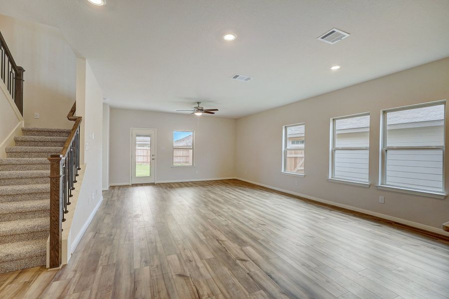 Dining room and living room in the Pearl floorplan at a Meritage Homes community.