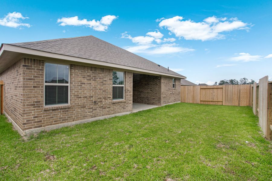 Front exterior of a new home in Bayou Maison, Dickinson, TX, highlighting curb appeal (Image 19).