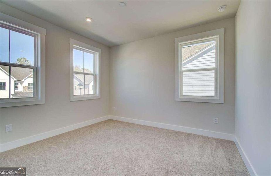 Spacious, unfurnished interior of a new home in The Paddocks at Doc Hughes, Buford (Image 38).