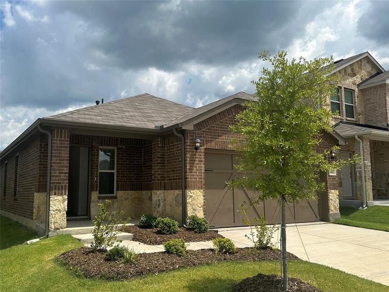 Front exterior of a new home in Cartwright Ranch, Crandall, TX, highlighting curb appeal (Image 2). Front exterior of a new home in Cartwright Ranch, Crandall, TX, highlighting curb appeal (Image 2).